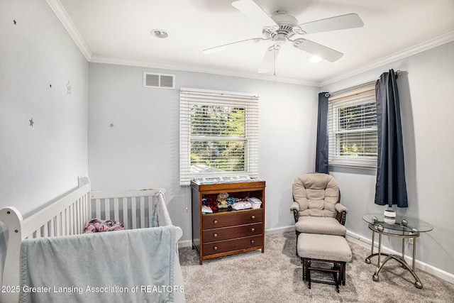 4326 Manitou Dr, Okemos, MI 48864 - carpeted bedroom with multiple windows, a crib, ornamental molding, and ceiling fan