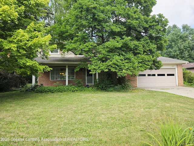 4326 Manitou Dr, Okemos, MI 48864 - obstructed view of property with brick siding and a front lawn