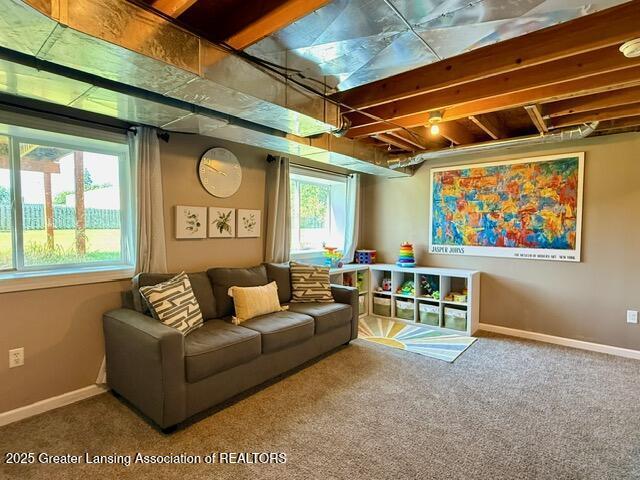 310 Brittany Ln, Mulliken, MI 48861 - carpeted living room featuring baseboards