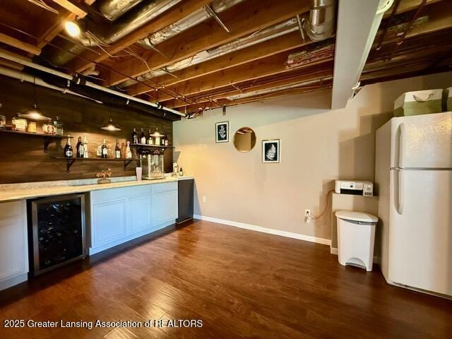 310 Brittany Ln, Mulliken, MI 48861 - indoor wet bar with freestanding refrigerator, beverage cooler, and dark wood-style flooring
