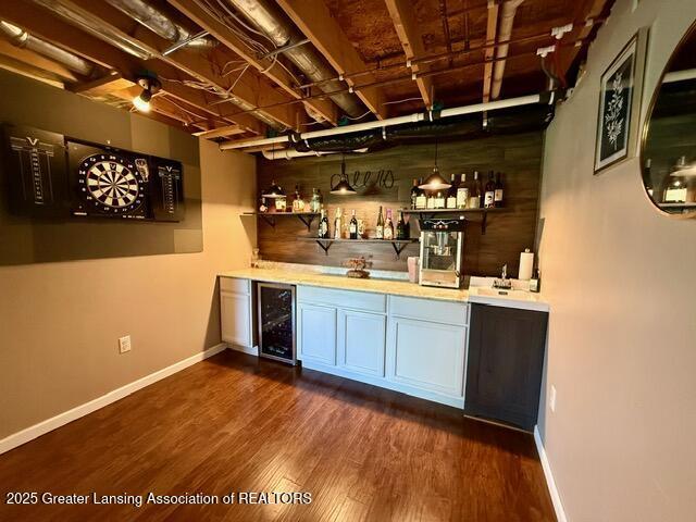 310 Brittany Ln, Mulliken, MI 48861 - indoor bar with wine cooler and dark wood finished floors