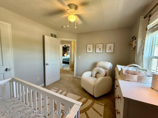 310 Brittany Ln, Mulliken, MI 48861 - bedroom with light carpet and ceiling fan