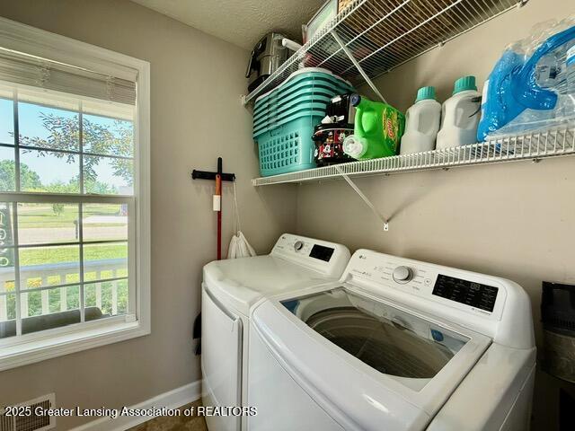 310 Brittany Ln, Mulliken, MI 48861 - laundry room with separate washer and dryer and healthy amount of natural light