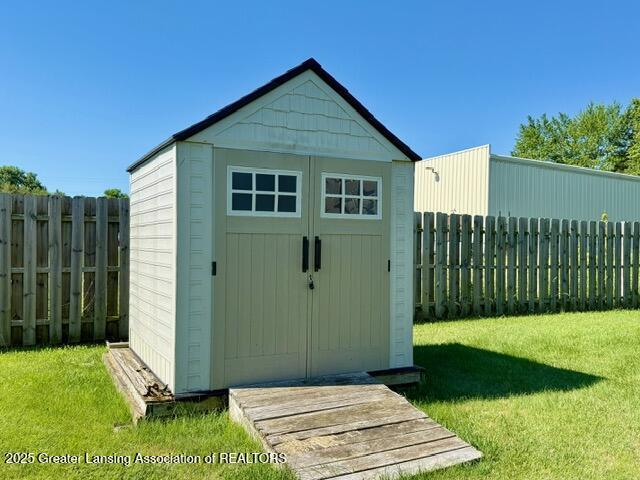 310 Brittany Ln, Mulliken, MI 48861 - view of shed featuring a fenced backyard
