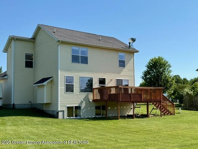 310 Brittany Ln, Mulliken, MI 48861 - rear view of property with stairs, a deck, and a yard