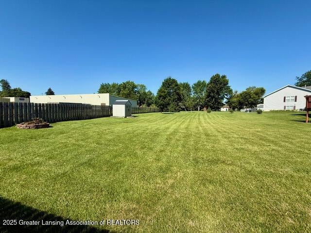 310 Brittany Ln, Mulliken, MI 48861 - view of yard featuring an outbuilding