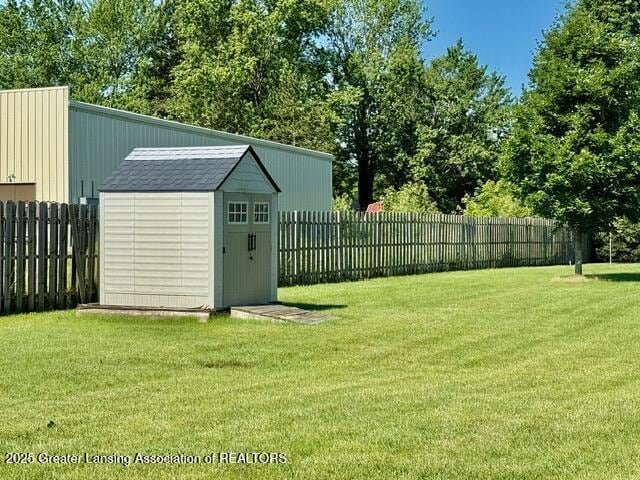 310 Brittany Ln, Mulliken, MI 48861 - fenced backyard with a shed