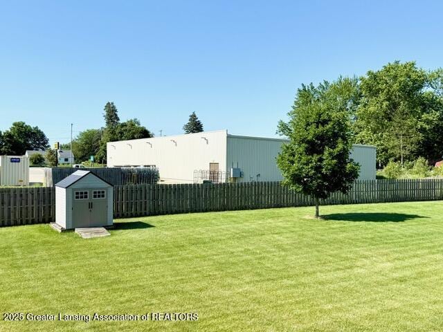310 Brittany Ln, Mulliken, MI 48861 - fenced backyard featuring a shed