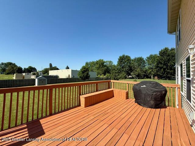 310 Brittany Ln, Mulliken, MI 48861 - deck featuring a shed and a fenced backyard