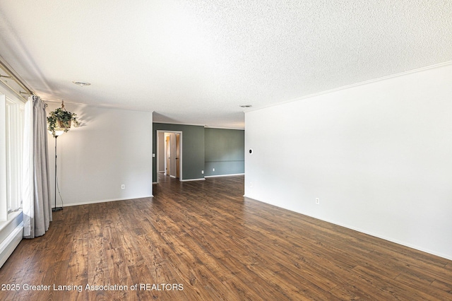 608 Belknap St, Grand Ledge, MI 48837 - spare room with dark wood-style floors and a textured ceiling