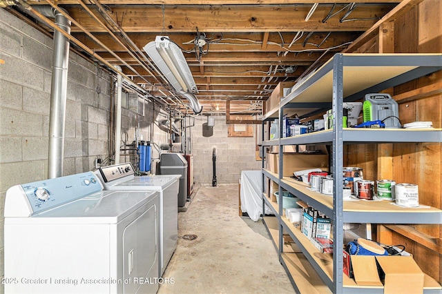 608 Belknap St, Grand Ledge, MI 48837 - unfinished basement featuring washer and dryer and concrete block wall