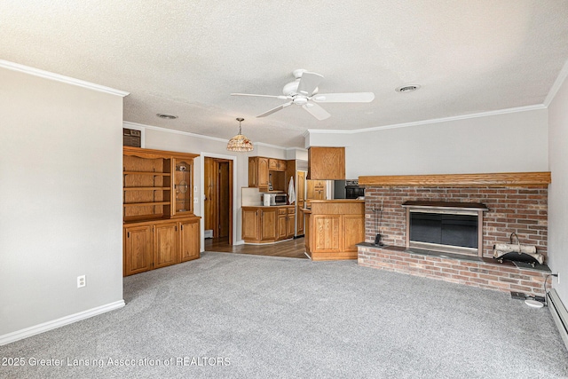 608 Belknap St, Grand Ledge, MI 48837 - unfurnished living room with a ceiling fan, light carpet, a brick fireplace, ornamental molding, and a textured ceiling