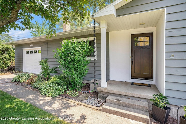 320 Mark St, Spring Lake, MI 49456 - entrance to property featuring a chimney and a garage