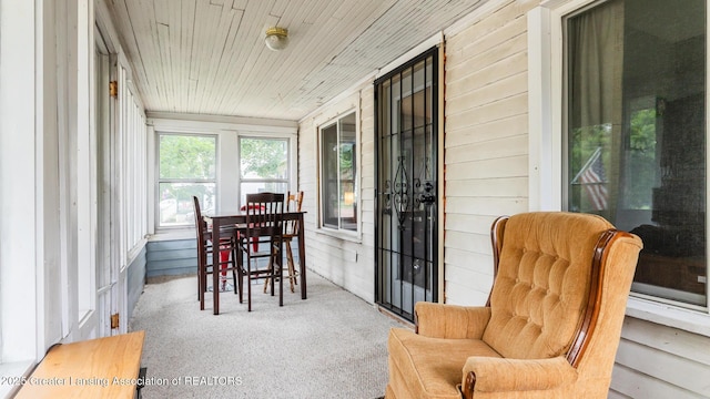 4461 Holt Rd, Holt, MI 48842 - sunroom / solarium with carpet flooring, wood walls, and wooden ceiling