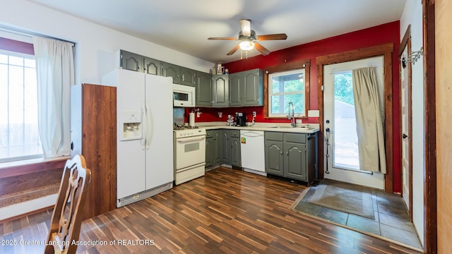 4461 Holt Rd, Holt, MI 48842 - kitchen with white appliances, gray cabinets, light countertops, a ceiling fan, and dark wood finished floors