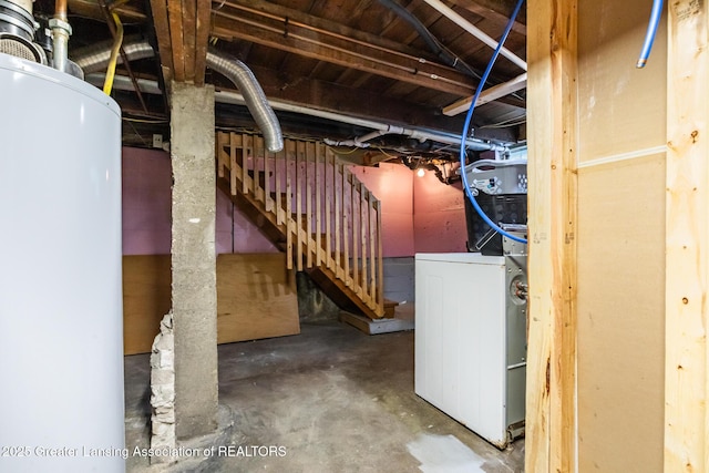 4461 Holt Rd, Holt, MI 48842 - unfinished below grade area with washer / dryer, water heater, and stairs