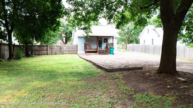 4461 Holt Rd, Holt, MI 48842 - fenced backyard featuring a deck