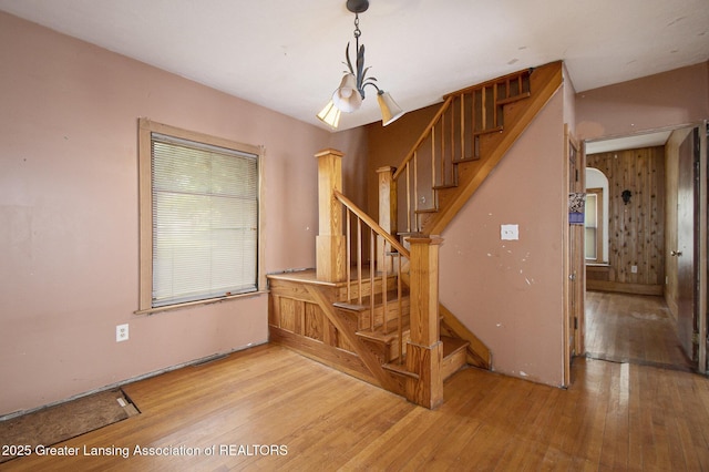 720 Kennedy St, Jackson, MI 49202 - stairs with wood-type flooring and arched walkways
