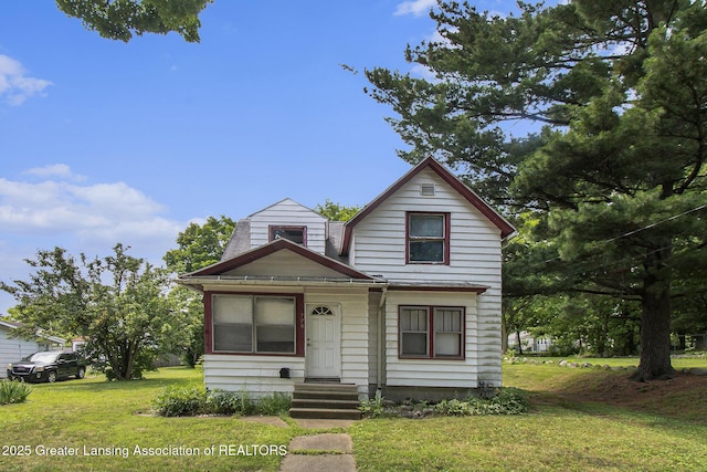 720 Kennedy St, Jackson, MI 49202 - view of front of house with a front lawn and entry steps