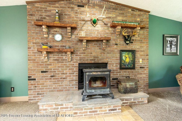 3536 Burkley Rd, Williamston, MI 48895 - detailed view of a wood stove, carpet floors, and a textured ceiling