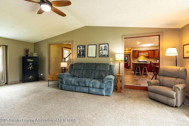 3536 Burkley Rd, Williamston, MI 48895 - carpeted living area featuring a ceiling fan and vaulted ceiling