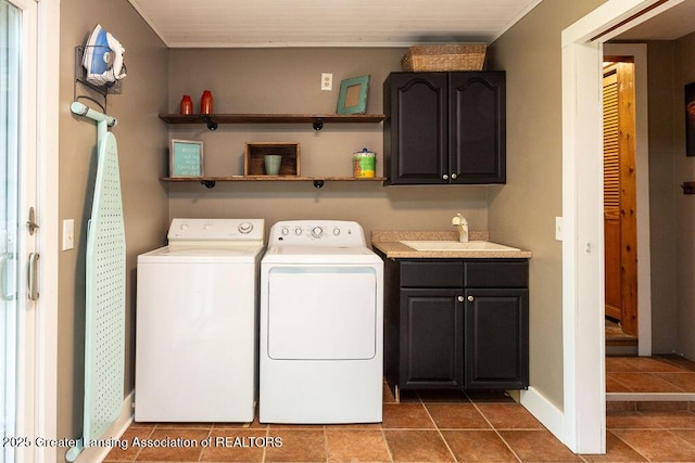 3536 Burkley Rd, Williamston, MI 48895 - laundry room with cabinet space, separate washer and dryer, and tile patterned floors