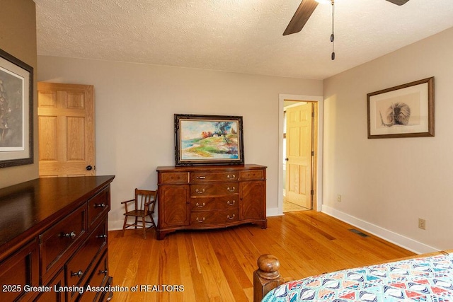3536 Burkley Rd, Williamston, MI 48895 - bedroom with light wood-style floors and a textured ceiling