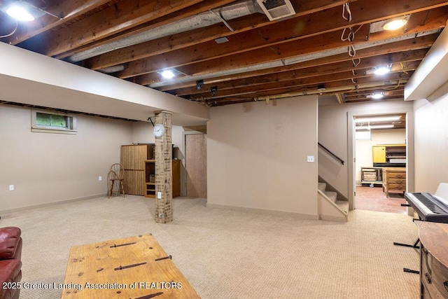 3536 Burkley Rd, Williamston, MI 48895 - finished basement with stairway and carpet flooring
