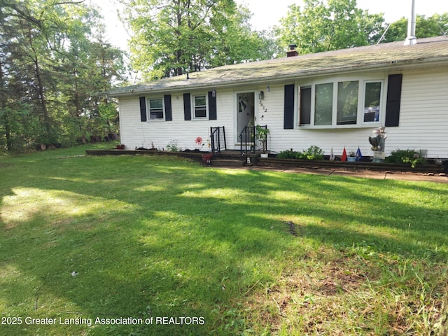 3612 Dell Rd, Holt, MI 48842 - ranch-style home featuring a front lawn and a chimney