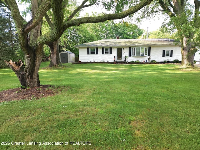 3612 Dell Rd, Holt, MI 48842 - single story home with a storage unit and a front lawn