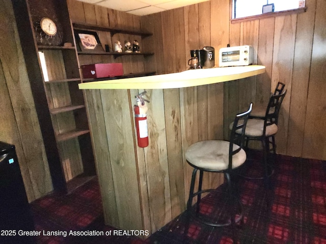 3612 Dell Rd, Holt, MI 48842 - indoor dry bar with wood walls and built in shelves
