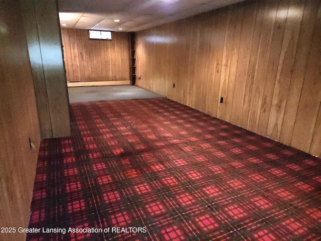 3612 Dell Rd, Holt, MI 48842 - finished below grade area featuring wooden walls and carpet floors