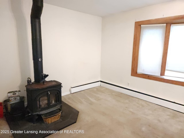 3612 Dell Rd, Holt, MI 48842 - empty room with a wood stove and carpet floors