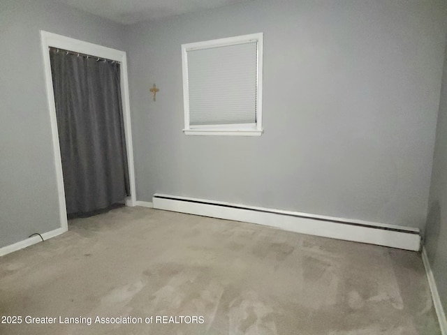 3612 Dell Rd, Holt, MI 48842 - unfurnished room with baseboard heating and carpet flooring