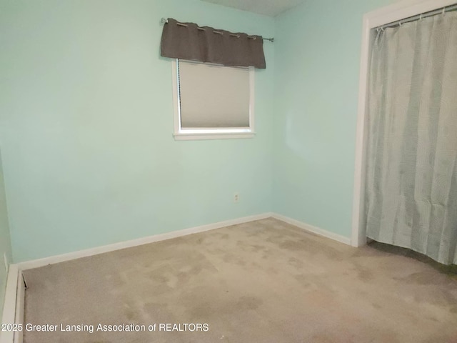 3612 Dell Rd, Holt, MI 48842 - unfurnished bedroom featuring carpet floors and baseboards