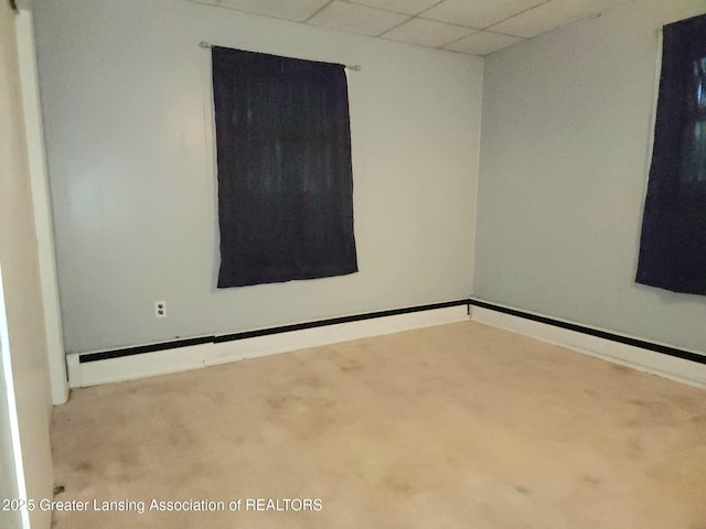 3612 Dell Rd, Holt, MI 48842 - carpeted empty room featuring a drop ceiling and baseboards