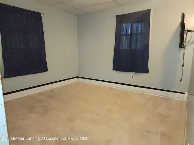 3612 Dell Rd, Holt, MI 48842 - spare room with a drop ceiling and baseboards