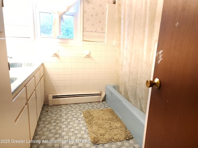 3612 Dell Rd, Holt, MI 48842 - full bath featuring a baseboard heating unit, vanity, shower / bath combo, tile patterned floors, and wainscoting