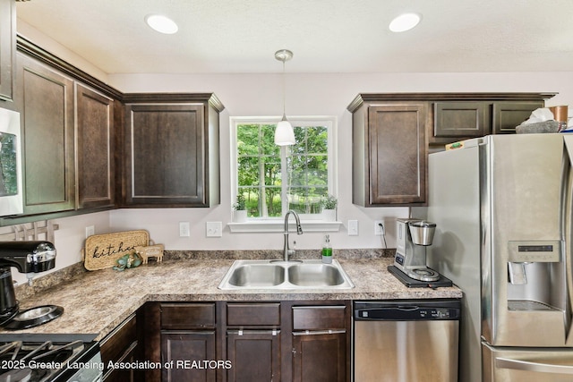 4930 N Campers Trl, Perrinton, MI 48871 - kitchen featuring stainless steel appliances, dark brown cabinets, decorative light fixtures, and recessed lighting