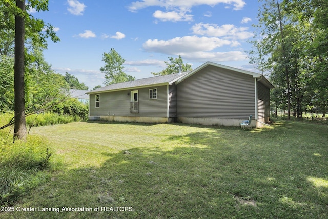 4930 N Campers Trl, Perrinton, MI 48871 - rear view of house featuring a yard