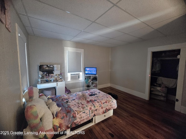 412 N Hickory St, Owosso, MI 48867 - bedroom featuring wood finished floors, a paneled ceiling, and cooling unit