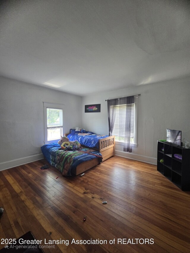 412 N Hickory St, Owosso, MI 48867 - bedroom featuring hardwood / wood-style flooring and baseboards