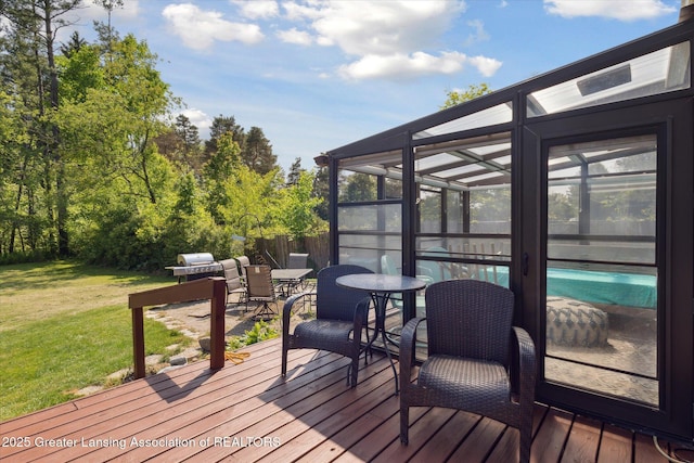 7050 E Eaton Hwy, Sunfield, MI 48890 - wooden terrace with a lawn, an outdoor pool, outdoor dining space, a lanai, and grilling area
