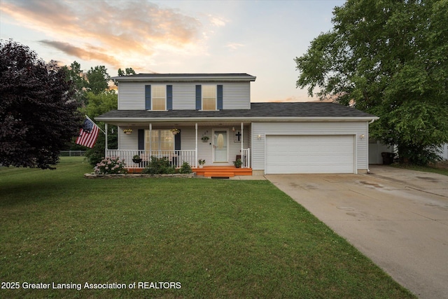 129 Elizabeth Way, Potterville, MI 48876 - traditional home featuring a garage, a porch, concrete driveway, and a front yard