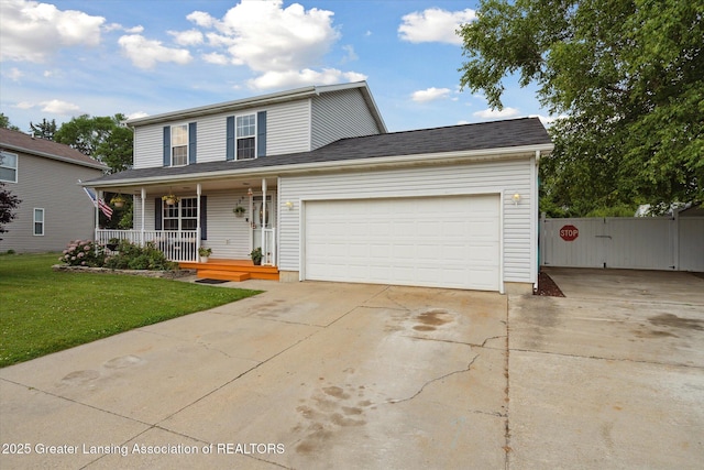 129 Elizabeth Way, Potterville, MI 48876 - traditional-style house featuring covered porch, concrete driveway, and an attached garage