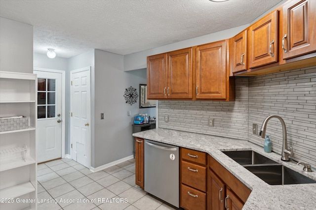 129 Elizabeth Way, Potterville, MI 48876 - kitchen featuring dishwasher, light tile patterned flooring, light stone countertops, brown cabinets, and decorative backsplash