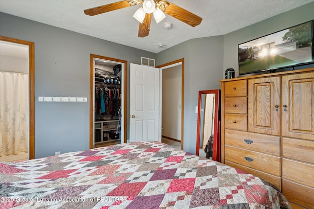 129 Elizabeth Way, Potterville, MI 48876 - bedroom featuring ceiling fan and a spacious closet