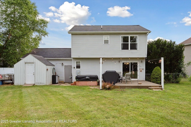 129 Elizabeth Way, Potterville, MI 48876 - rear view of property with a hot tub, a patio, and a storage shed