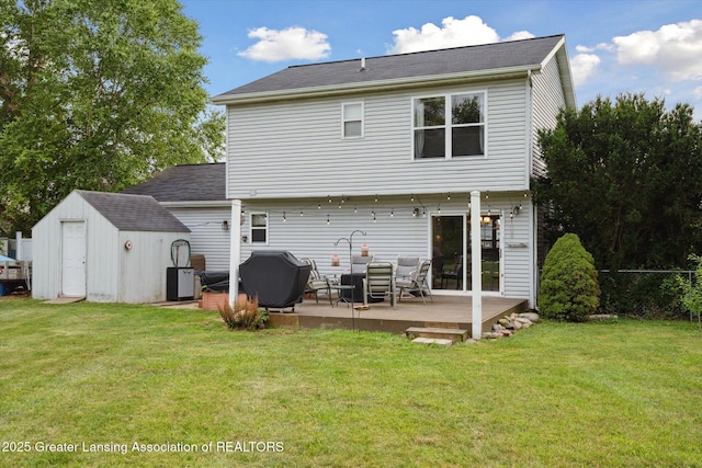 129 Elizabeth Way, Potterville, MI 48876 - back of property with a storage shed and a deck
