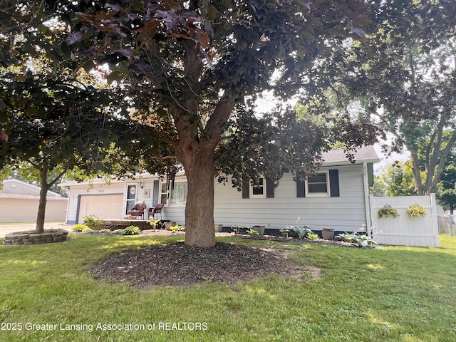 709 N Mead St, Saint Johns, MI 48879 - obstructed view of property featuring a garage
